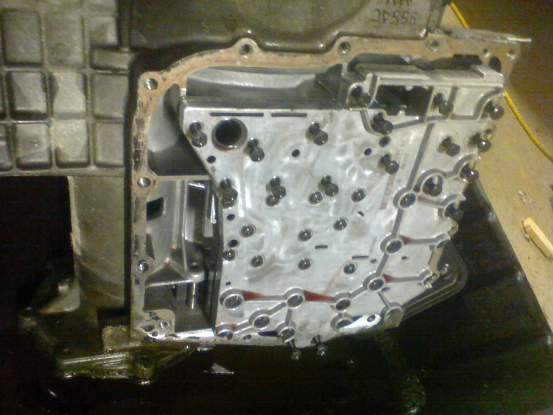 With the filter out of the way, we can start loosening some of the valve body bolts. BUT NOT ALL OF THEM!